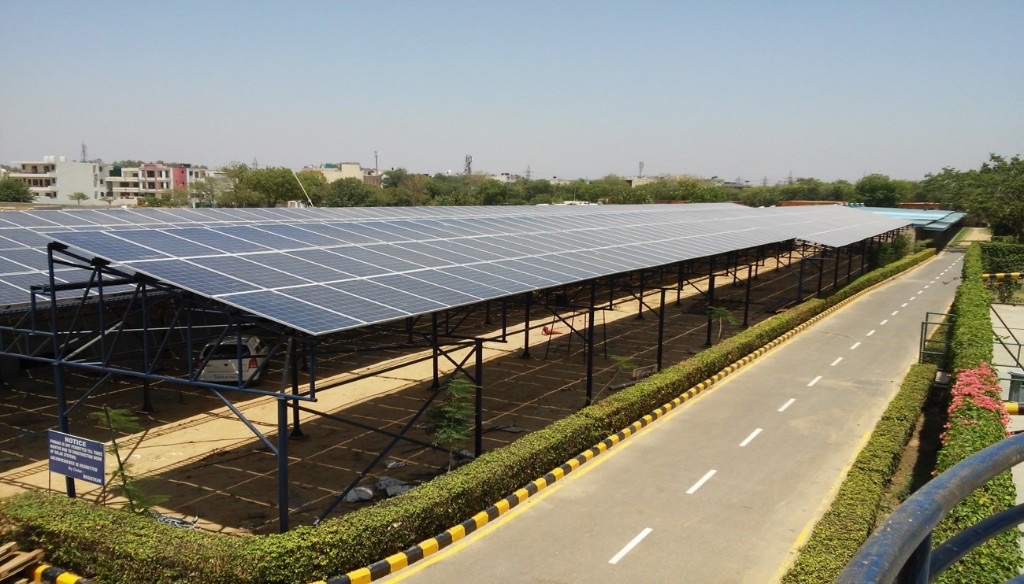 ITM University Gurgaon solar carport — elevated parking-shed array over marked bays