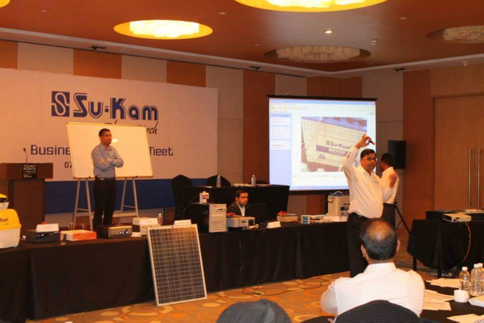 Product demonstration including solar panels at a Su-Kam Business Partners Meet