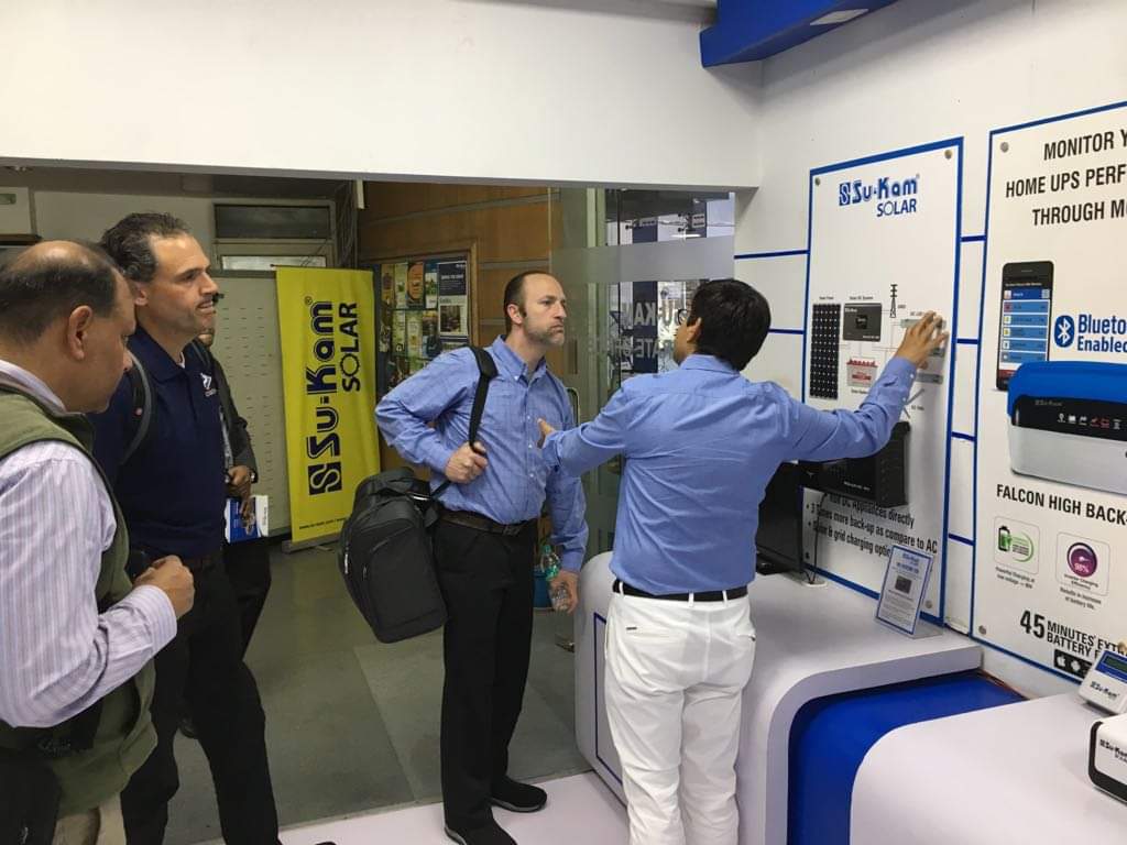 Demonstrating Su-Kam solar products to international partners.
