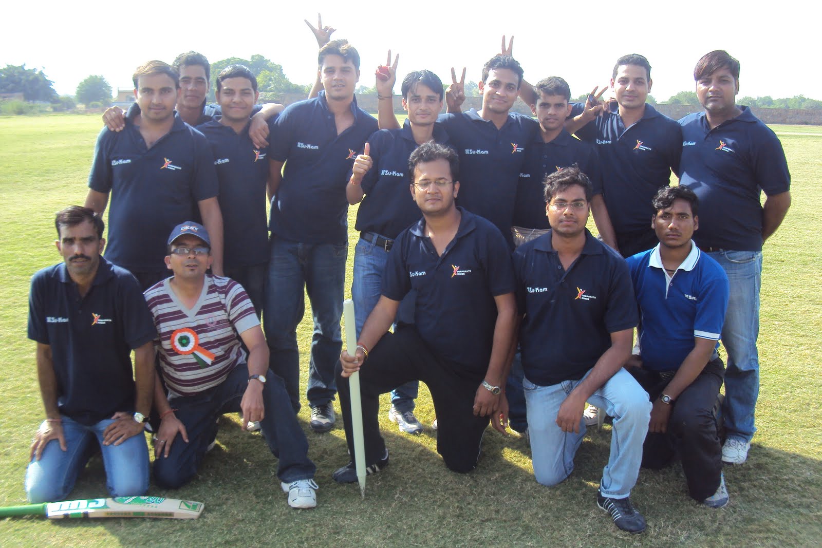 The Su-Kam cricket XI on the field.