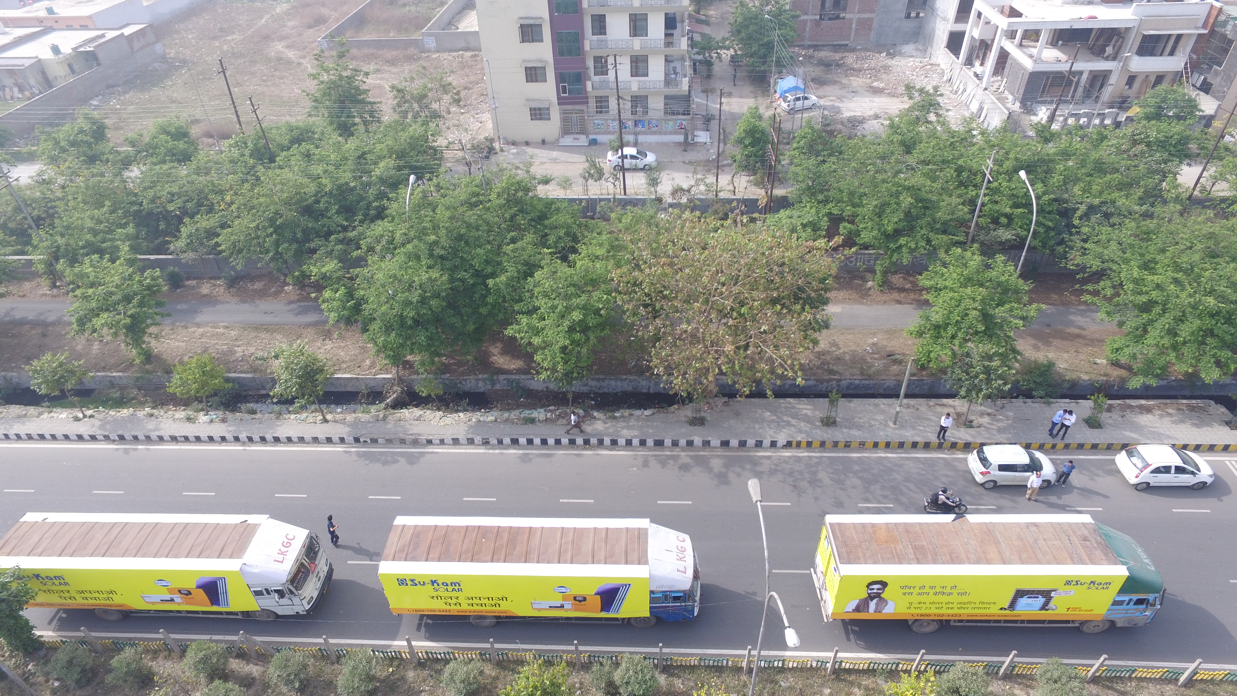The branded fleet from the air — moving billboards by the dozen.